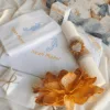 Trusou de botez băiat personalizat Aventura Pe Mare cu prosop brodat, panza de mir, fasa și lumânare din ceară de albine, set complet pentru slujbă